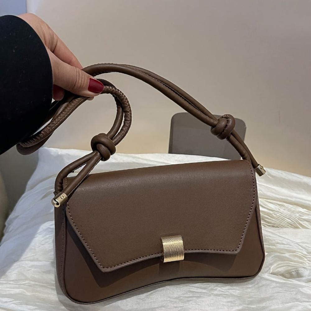 Eine Umhängetasche Mit Vintage-Eleganz Und Moderner Funktionalität
