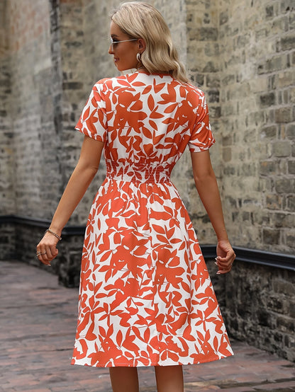Kleid Mit Wickelkragen Und Blumenmuster